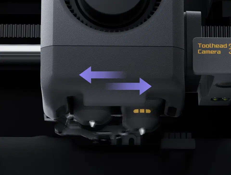 Close-up render of the X2D toolhead underside with two nozzle tips and purple arrows showing the sideways lift that swaps them