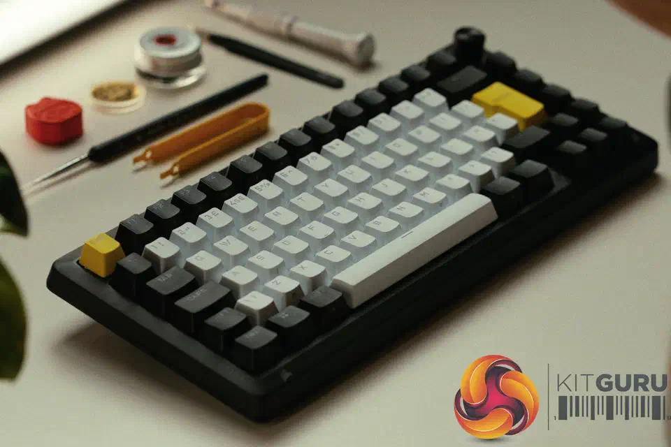 Corsair Makr Pro 75 keyboard at a three-quarter angle showing the black aluminium case, white and grey keycaps, and a yellow ESC key