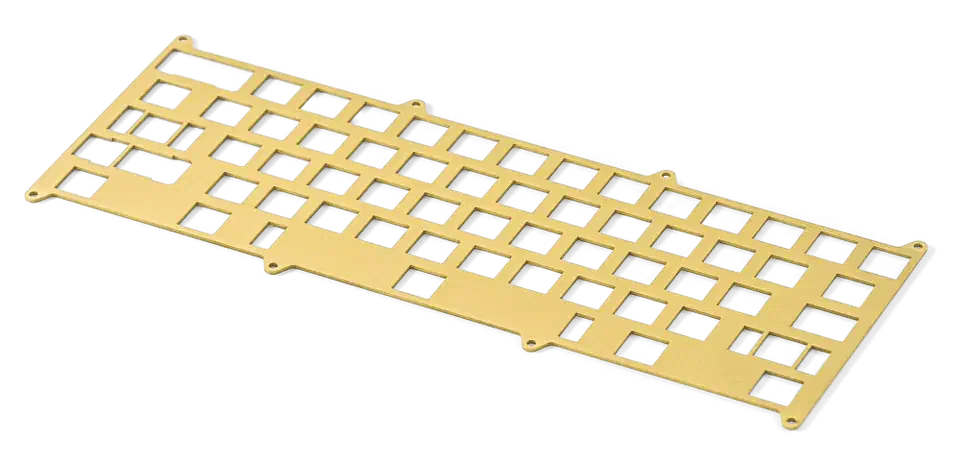 Gold-colored brass keyboard switch plate with switch cutouts, shown on a white background