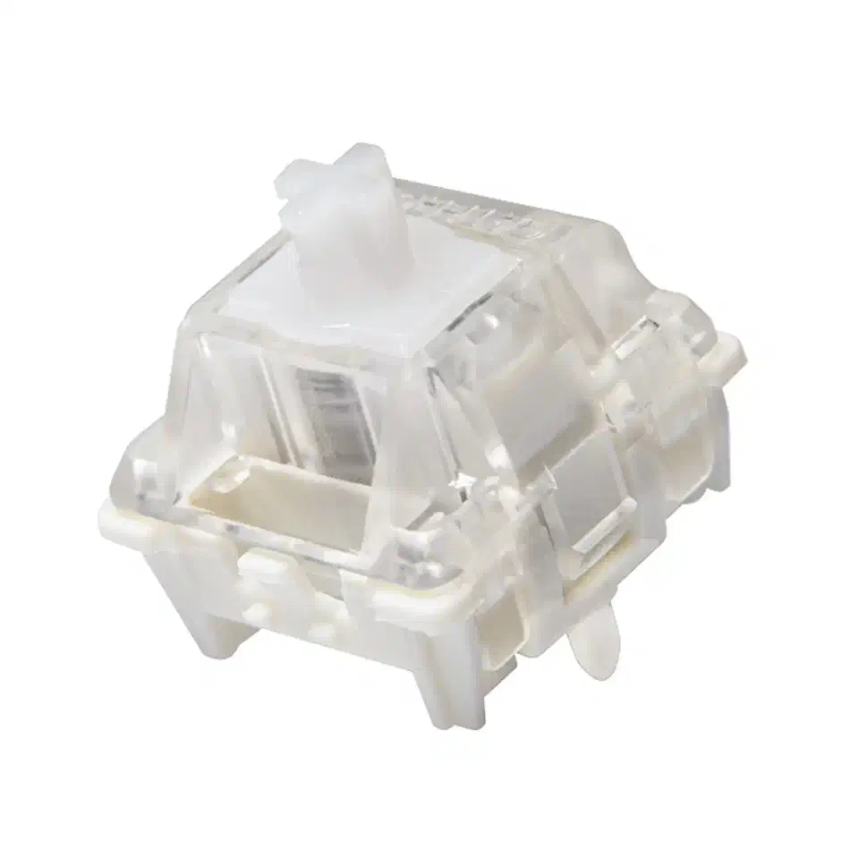 Gateron KS-20 magnetic switch with a clear housing, white stem and cream base, showing the internal spring and magnet