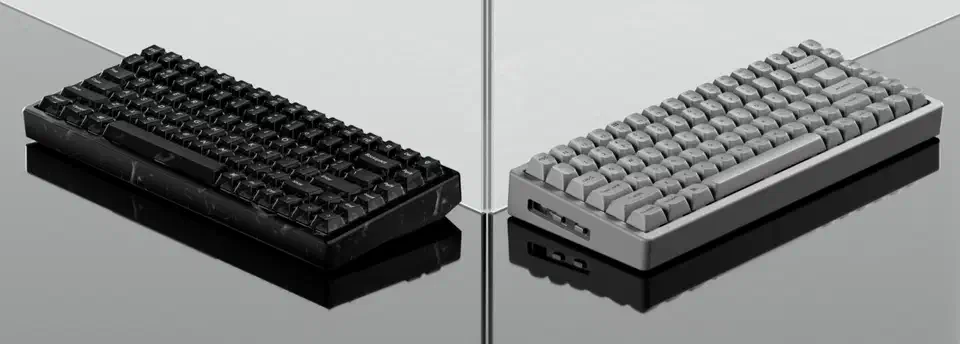 Black resin K2 HE on the left and grey concrete K2 HE on the right, shown side by side on a reflective surface
