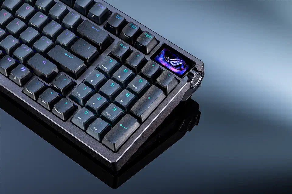 Close-up of the Azoth 96 HE right edge showing the small colour OLED screen and the metal control knob beside the number pad