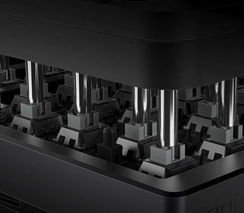 Cutaway view inside the ROG Azoth 96 HE showing bare magnetic switch stems seated in the plate with keycaps lifted off