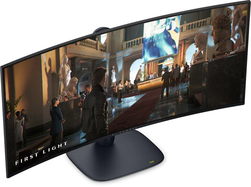 Alienware AW3426DW seen from an angled front three-quarter view, its curved QD-OLED screen lit with a game scene, standing on the arm and flat base