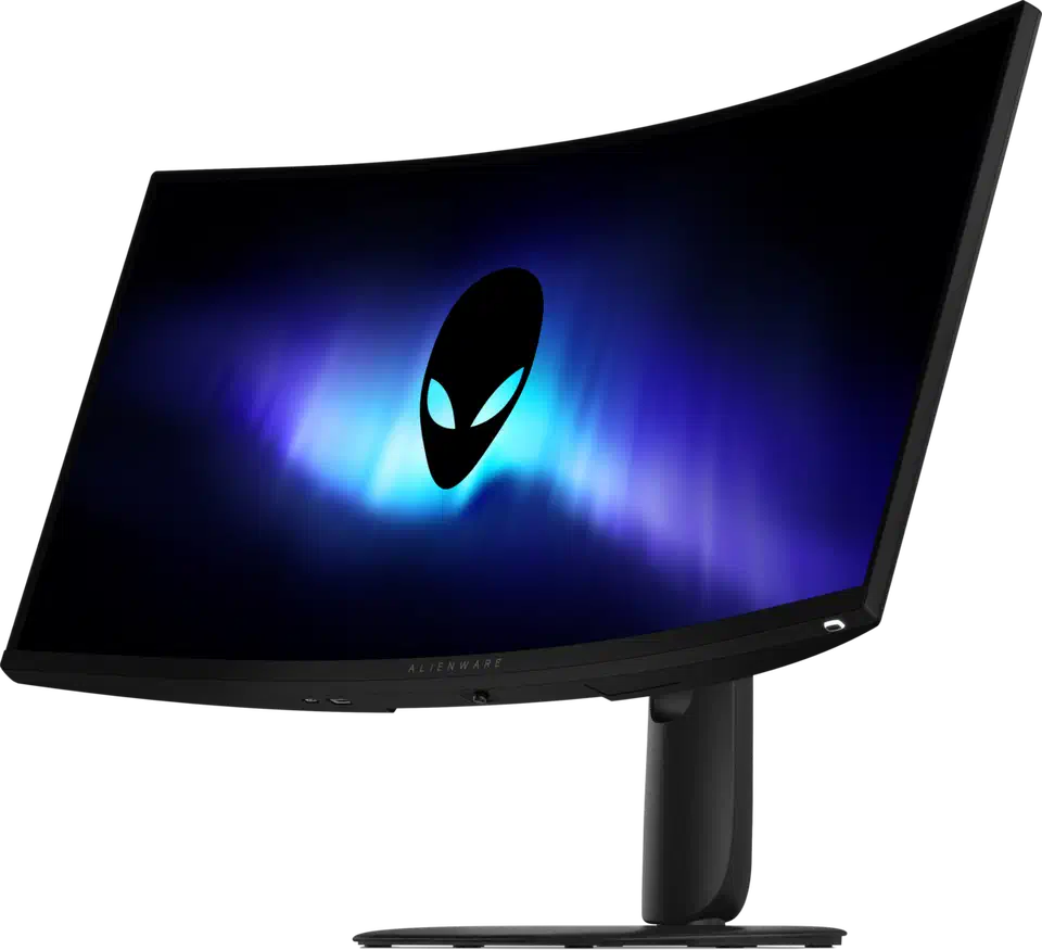 Alienware AW3426DWM seen from an angled front three-quarter view, the curved screen lit with an alien head wallpaper, showing the panel wrap and the pedestal stand