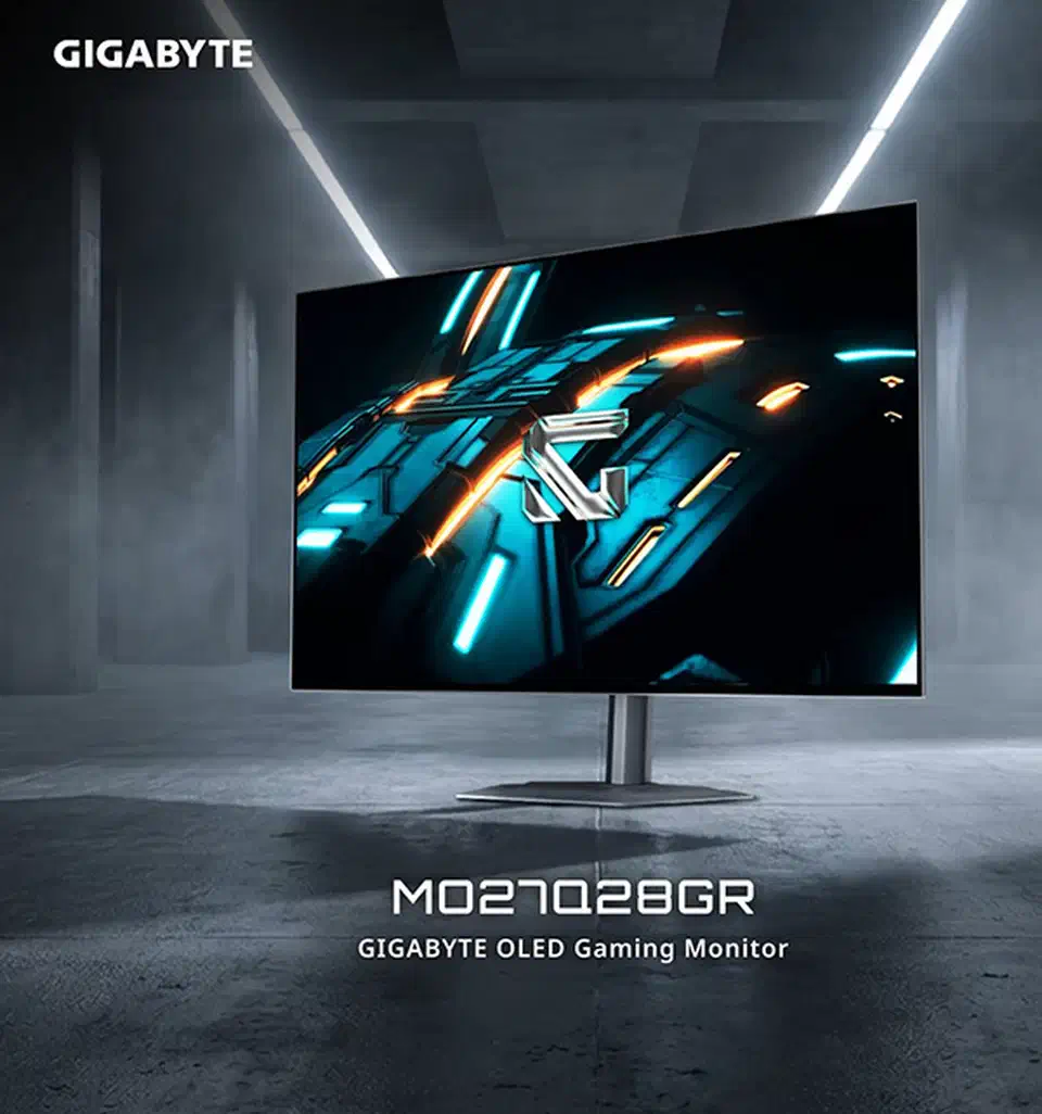 Gigabyte MO27Q28GR, the glossy RealBlack Tandem WOLED version of the MO27Q28G, standing in a grey concrete room with a bright teal and orange image on screen