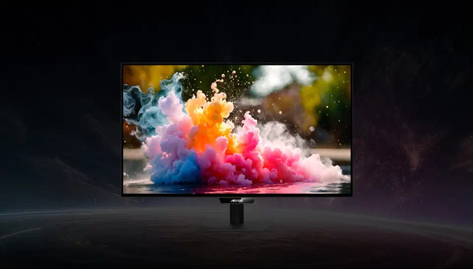 Gigabyte Aorus FO27Q28G press photo, a thin-bezel 27-inch OLED monitor on a slim central stand showing a colourful smoke render