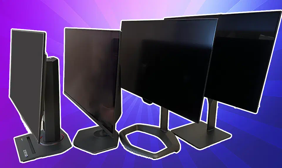 Four OLED gaming monitors lined up at angles for a side-by-side coating comparison test