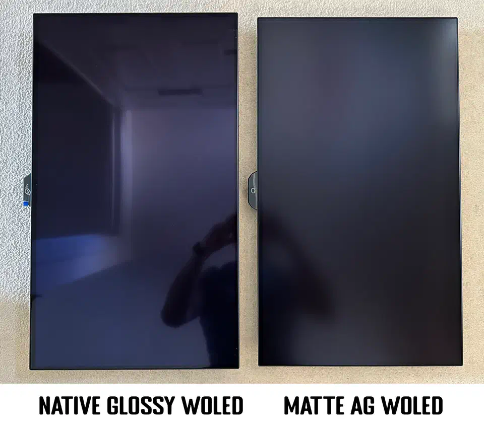 Native glossy WOLED panel on the left reflecting the room sharply like a mirror, matte AG WOLED panel on the right diffusing the same reflection into a soft haze
