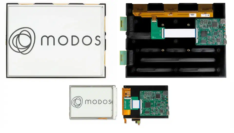 Modos Paper FPGA controller boards mounted behind a 13.3-inch and a 6-inch e-ink panel, green PCBs with ribbon cables