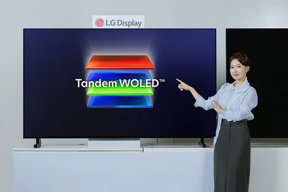 LG Display Primary RGB Tandem 2.0 WOLED television panel displayed on a stand in a dark demo room