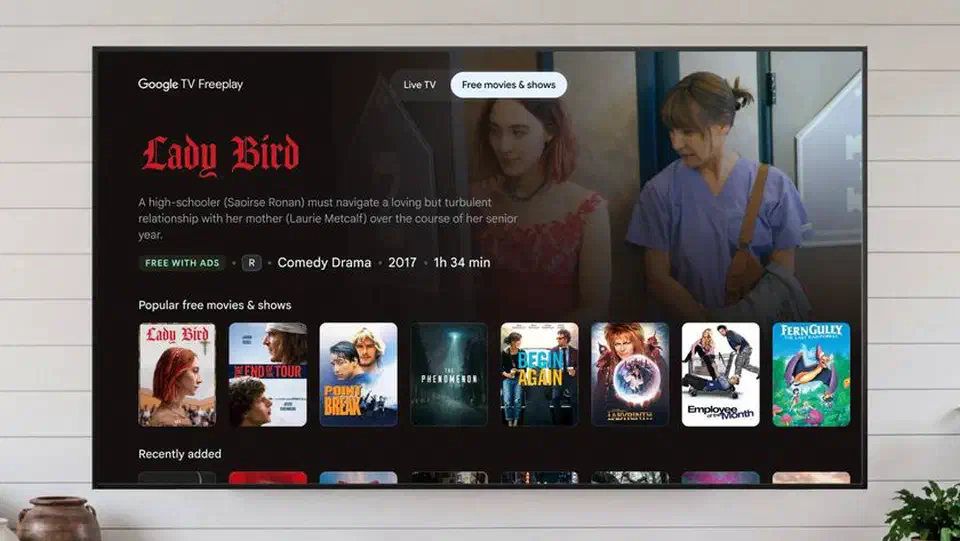 LG G5 OLED television on a stand showing a bright landscape image
