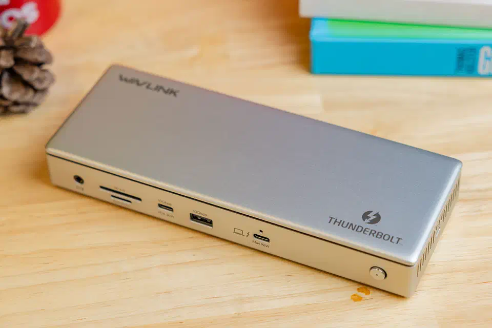 Wavlink Thunderbolt 4 triple-display dock standing upright with USB-C, USB-A, HDMI and Ethernet ports along its edge