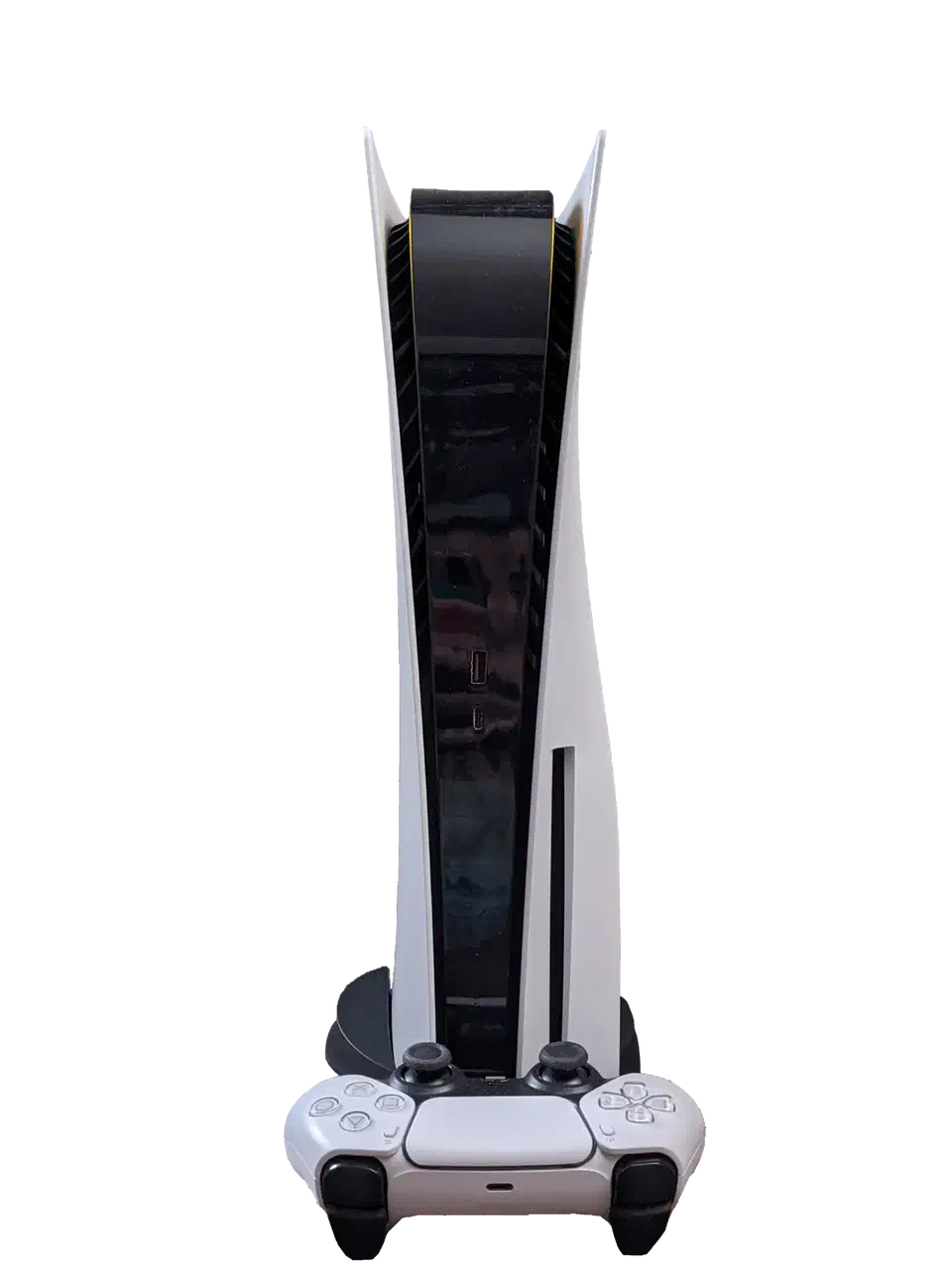Sony PlayStation 5 console standing upright next to a white DualSense controller