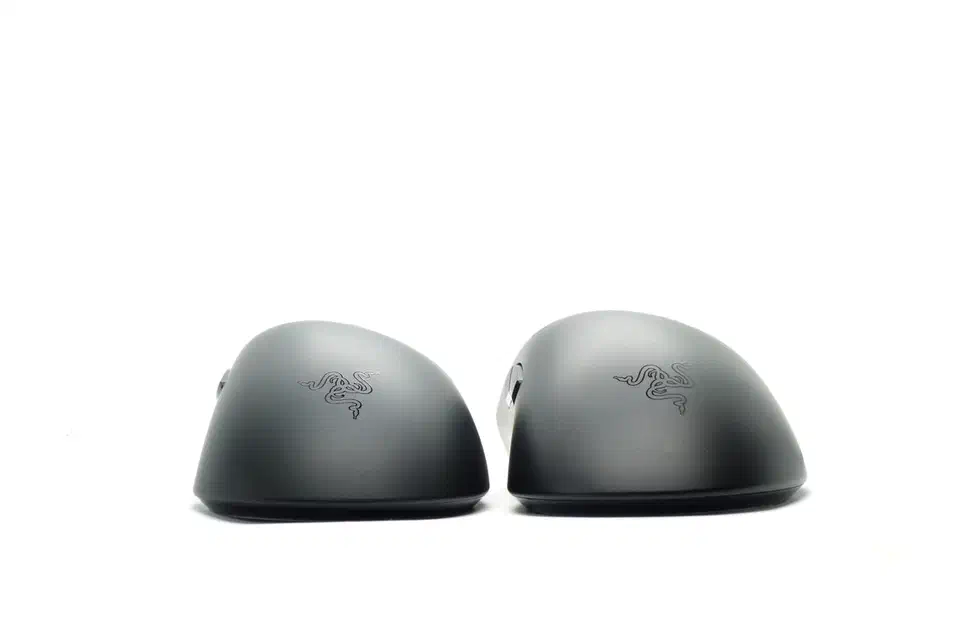 Rear view of two black Razer mice showing the shorter, lower hump on the HyperSpeed next to the taller DeathAdder V3