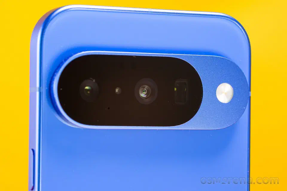 Close-up of the Pixel 10&rsquo;s full-width pill-shaped camera bar spanning the entire width of the blue glass back
