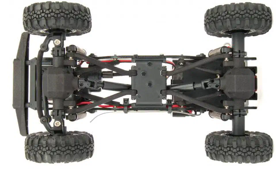 Underside view of the Enduro24 chassis showing the front and rear 4-link suspension arms, coil-over shocks and center driveshafts