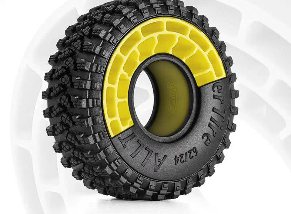 Yellow INJORA molded silicone insert seated inside a 1.0 inch crawler tire, propping up the sidewall