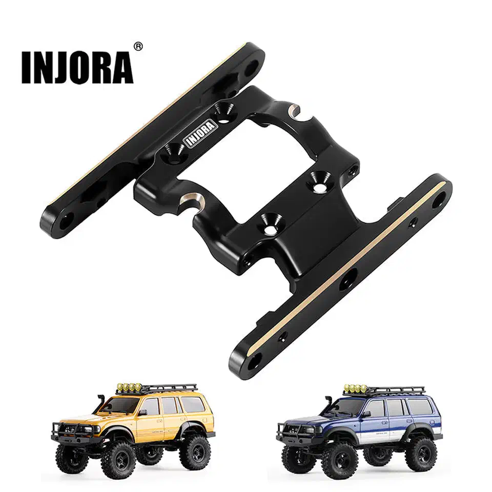 Brass-weighted chassis skid brace for the FMS FCX18 above a yellow and a blue FCX18 crawler