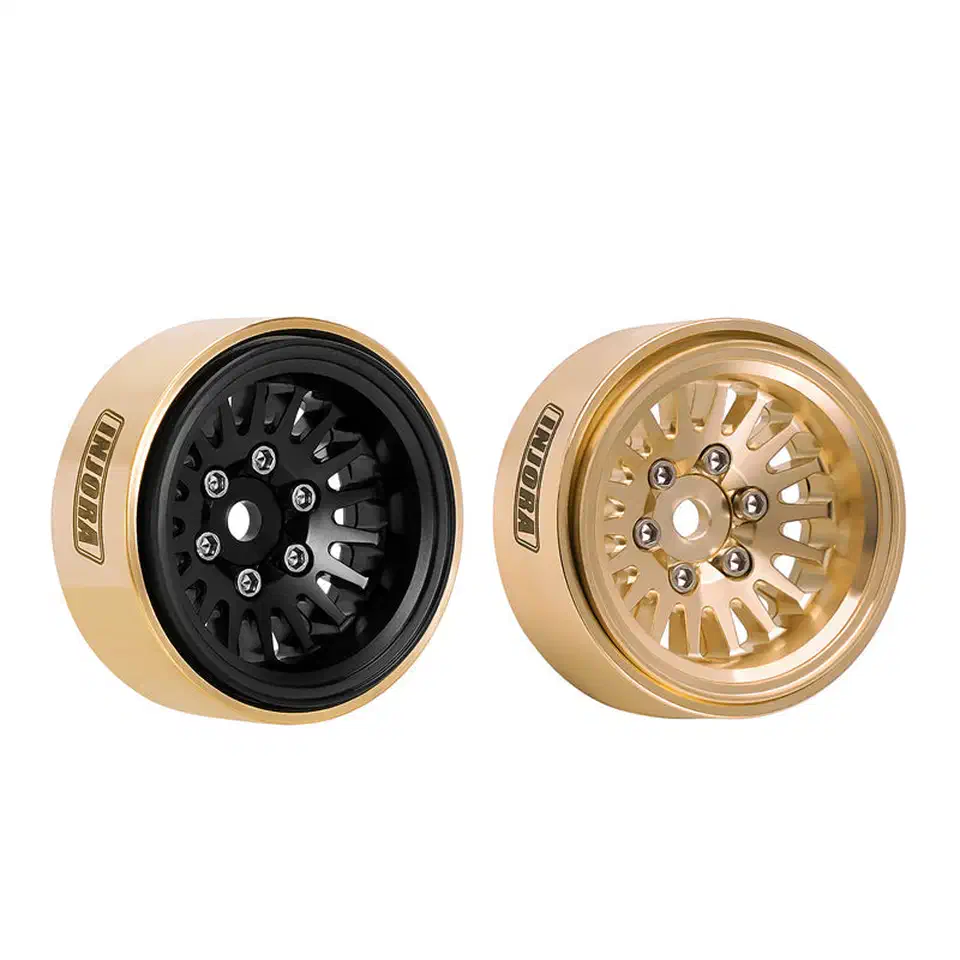 Two INJORA 1.0 Plus brass beadlock wheel rims side by side, one with a black face and one in plain brass