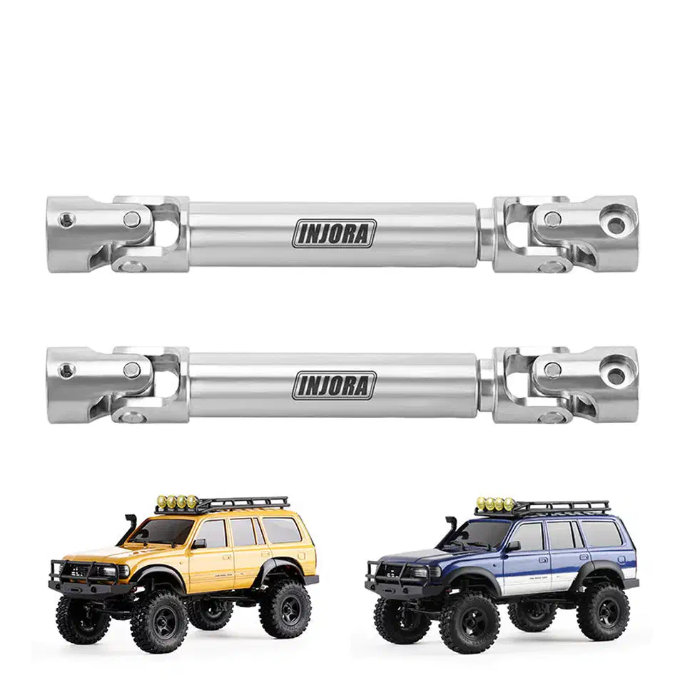 Two polished stainless steel drive shafts with universal joints above a yellow and a blue FMS FCX18 crawler