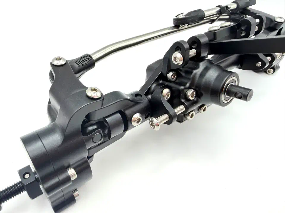 Close-up of the Reefs XP199 portal gearbox at the wheel end, with the axle tube raised above the wheel hub and the diff housing beside it