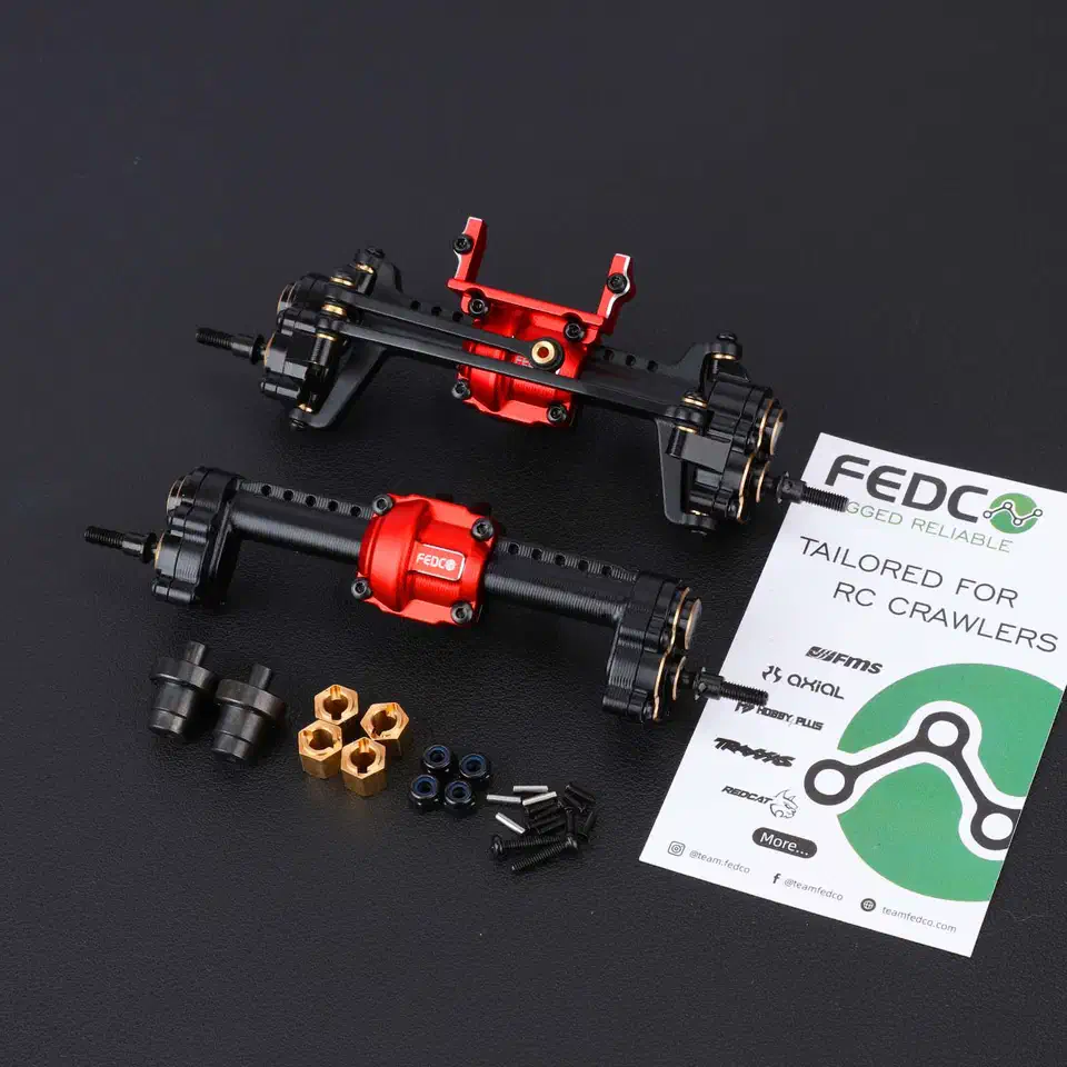 FEDCO FCX24 portal axle set laid out with brass hexes, driveshafts and hardware