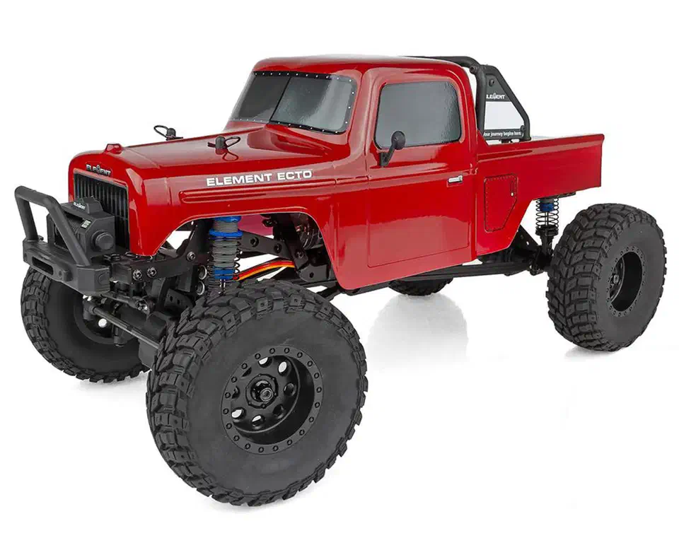 Element RC Enduro12 Ecto 1/12 trail truck with a red retro pickup body and black beadlock wheels