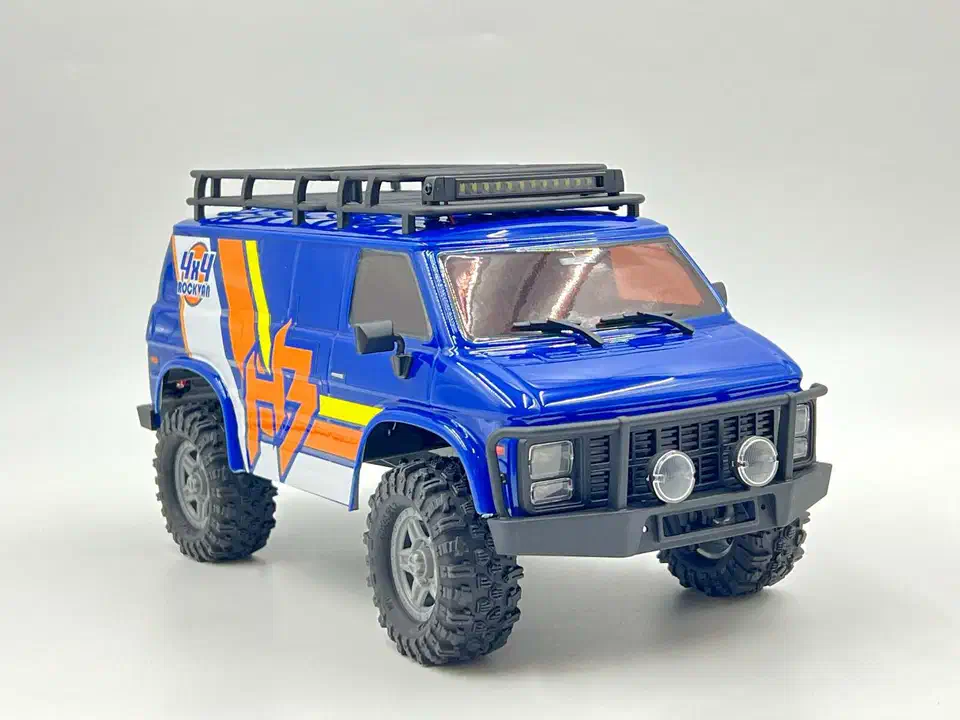 Hobby Plus CR18P Evo V2 mini crawler with a blue Rock Van body, roof rack, and LED light bar