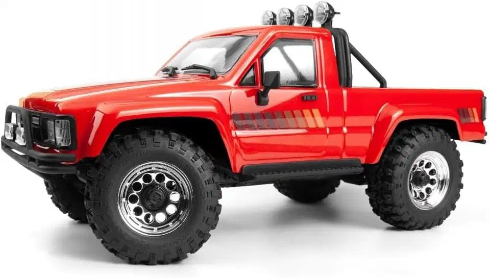 HPI Venture 18 crawler with a red 1985 Toyota Hilux pickup body and roof-mounted light bar