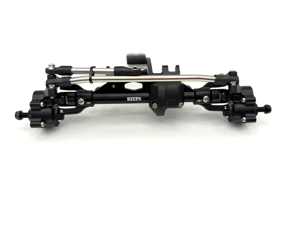 Full Reefs XP199 aluminum portal front axle in black, showing the two portal boxes, center diff housing, steering link, and C-hubs